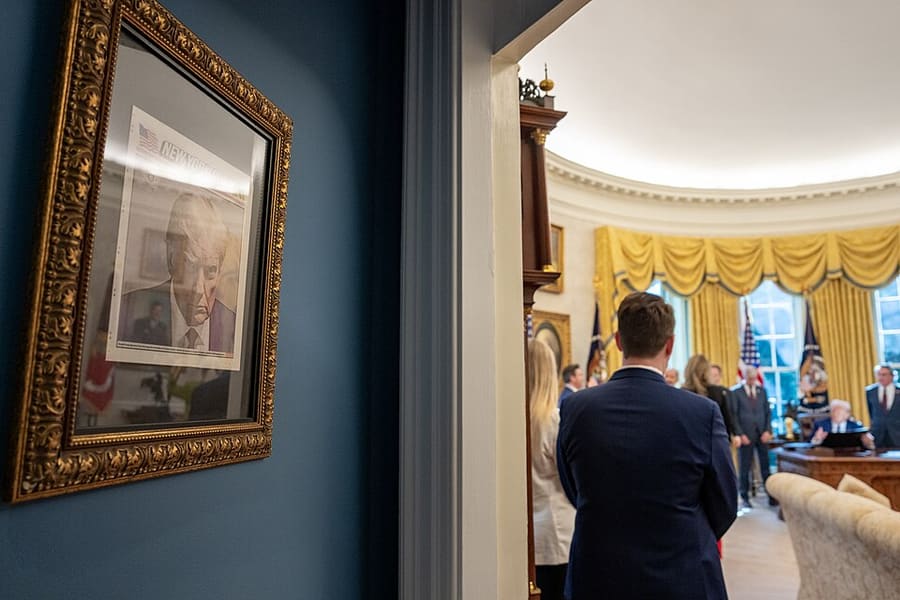 Donald Trump’s booking photo, framed outside the Oval Office